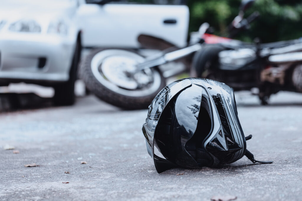 black helmet on street motorcycle crash attorney bakersfield