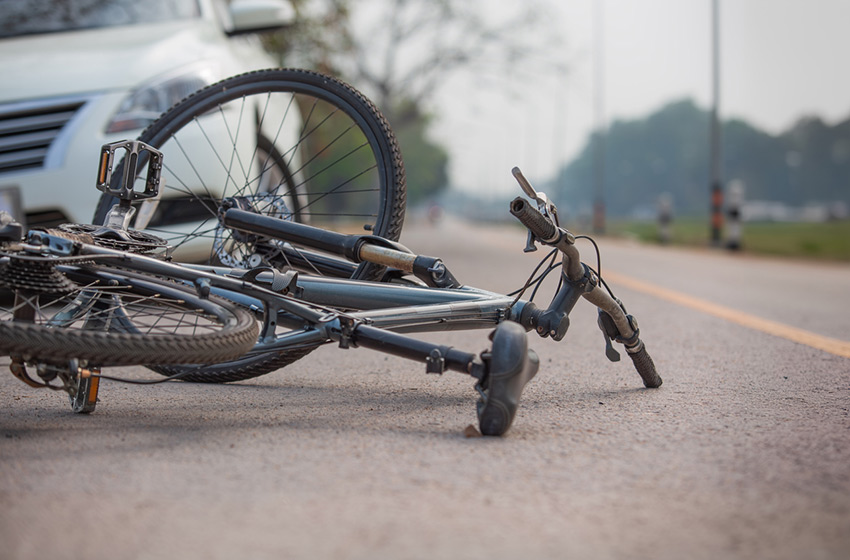 Photograph of bicycle after crash with car, to represent Chain Law, bicycle accident lawyers