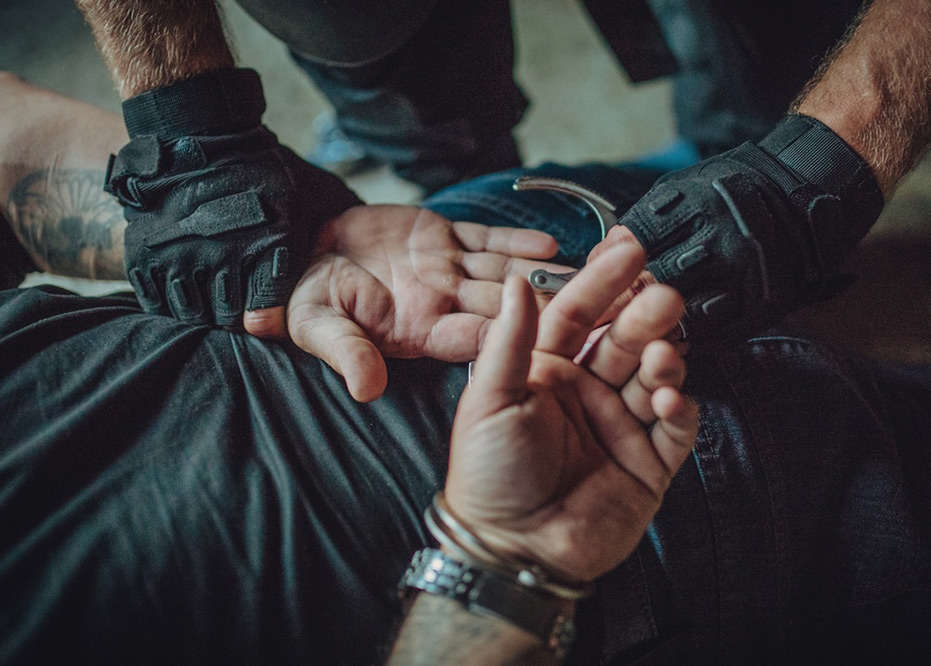 Police violence, Special police forces putting handcuffs on a man, bakersfield police misconduct lawyers